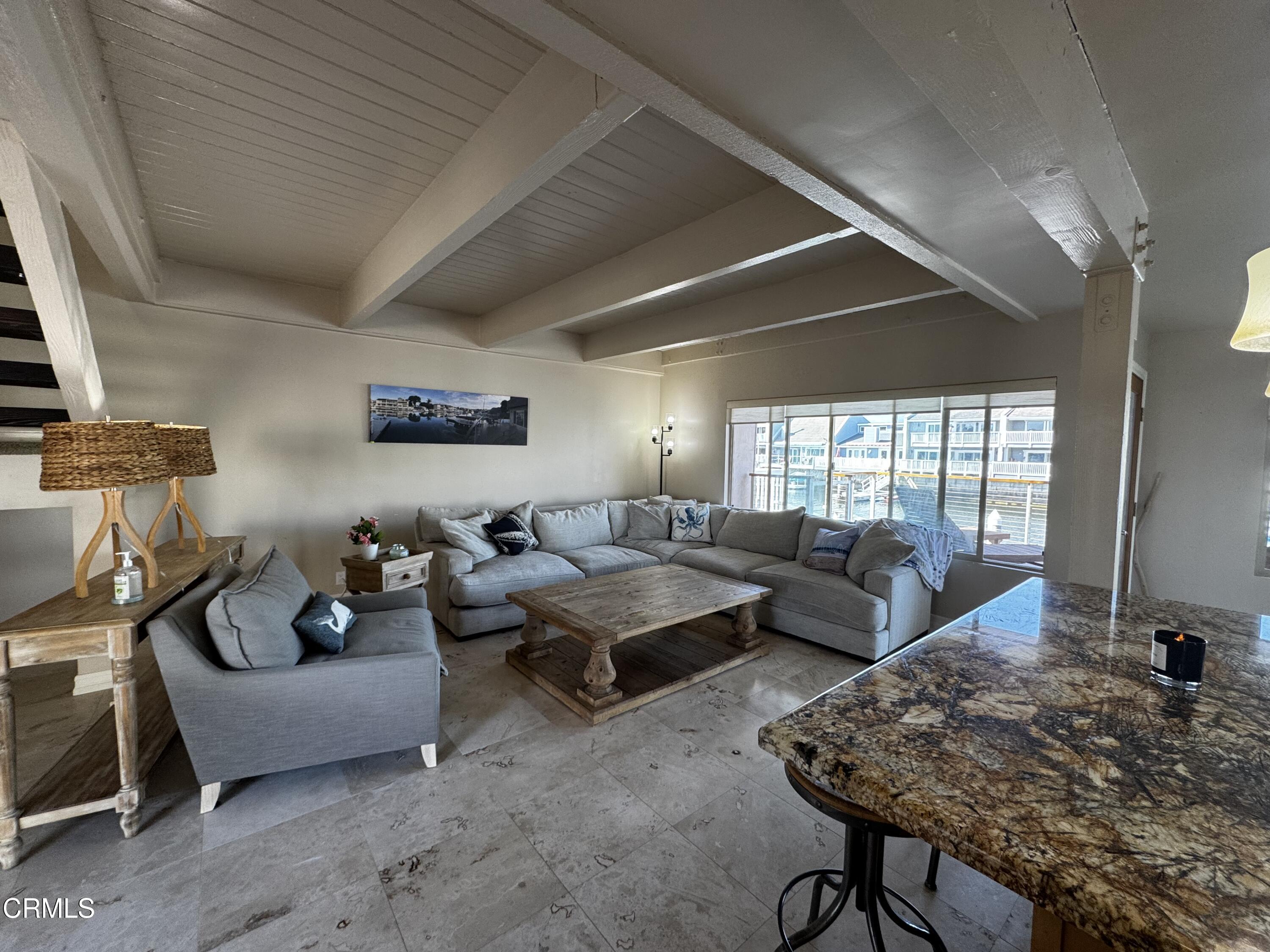 4435 Costa De Oro Oxnard, CA 93035 - Photo 8 of 50 a living room with furniture a rug potted plant and a large window