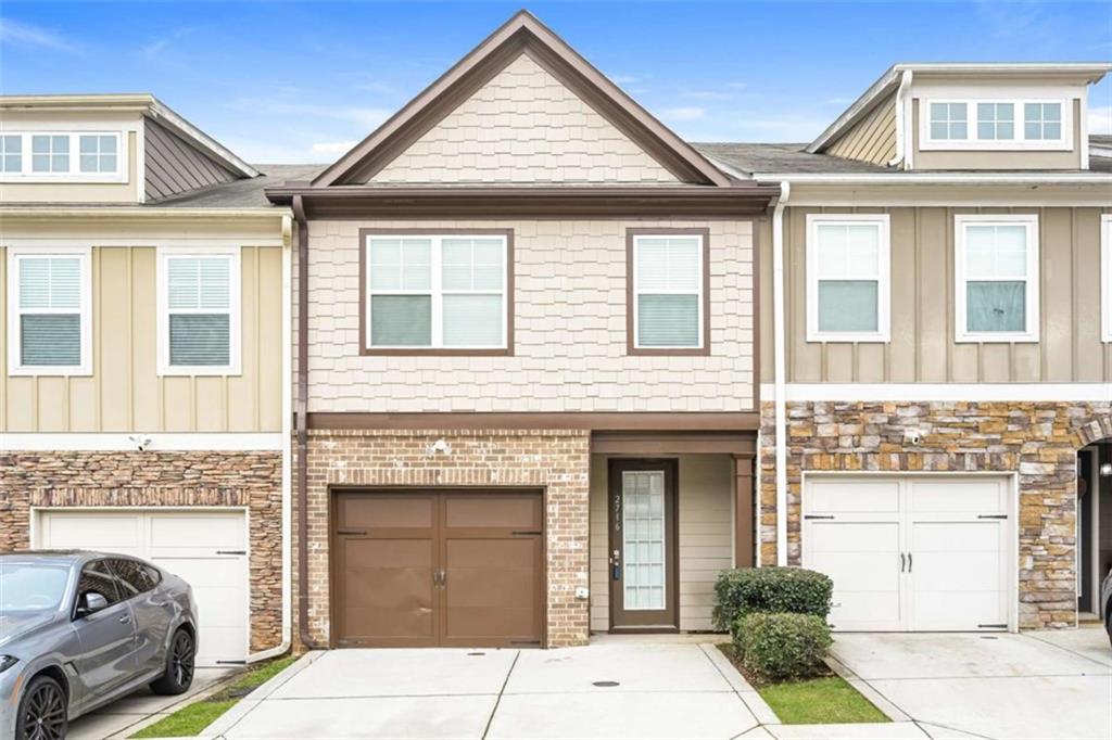 a front view of a house with a garage