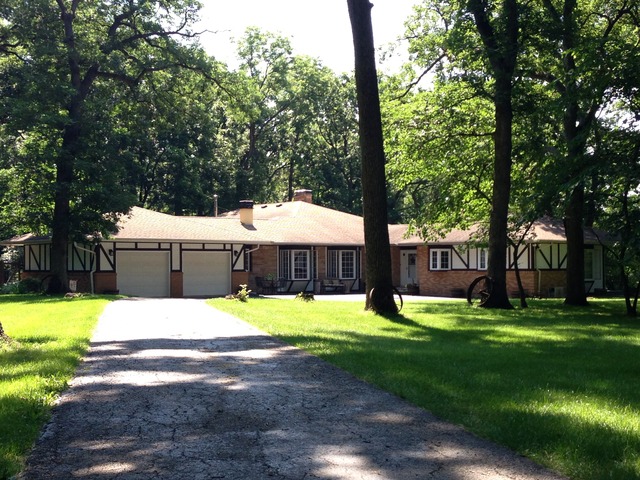 32730 Pleasant Hill Road Genoa, IL 60135 - Photo 1 of 23 a view of a house with backyard and a tree