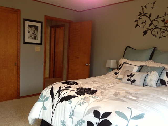 32730 Pleasant Hill Road Genoa, IL 60135 - Photo 12 of 23 a bedroom with a bed and a painting on the wall