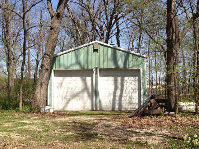 32730 Pleasant Hill Road Genoa, IL 60135 - Photo 17 of 23 a view of a house with a large tree and a yard