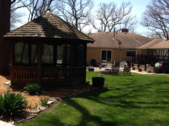 32730 Pleasant Hill Road Genoa, IL 60135 - Photo 18 of 23 a backyard of a house with yard table and chairs
