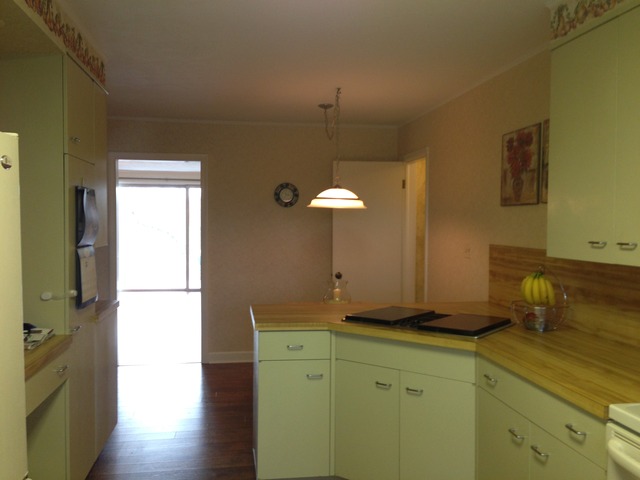 32730 Pleasant Hill Road Genoa, IL 60135 - Photo 3 of 23 a kitchen with a refrigerator and a stove