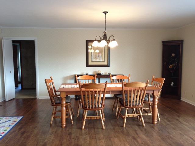 32730 Pleasant Hill Road Genoa, IL 60135 - Photo 4 of 23 a view of a dining room with furniture wooden floor and chandelier