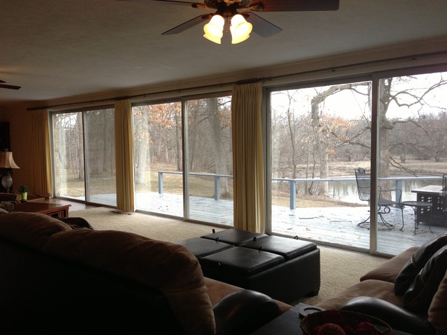 32730 Pleasant Hill Road Genoa, IL 60135 - Photo 6 of 23 a bedroom with a bed and large windows