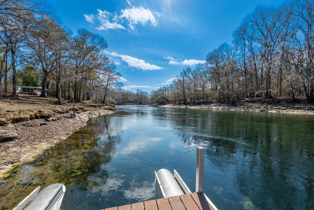 498 Southwest Manatee Terrace Fort White, FL 32038 - Photo 19 of 50 a backyard of a house with lots of green space