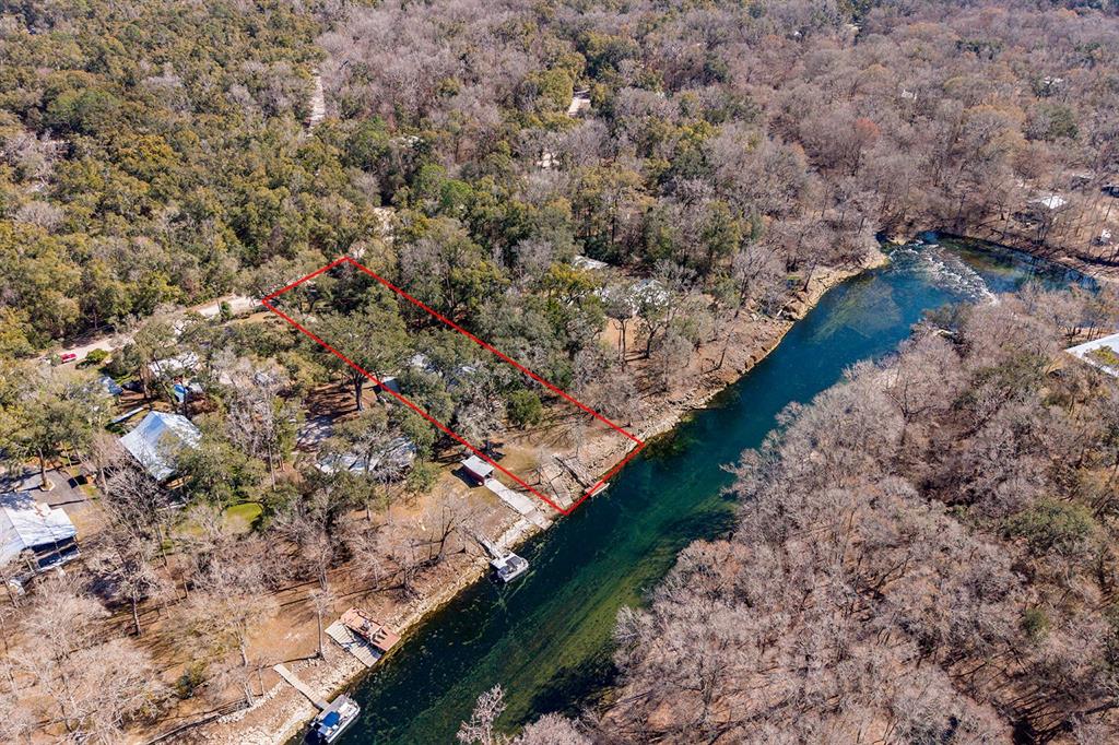 498 Southwest Manatee Terrace Fort White, FL 32038 - Photo 22 of 50 a view of a yard with wooden floor