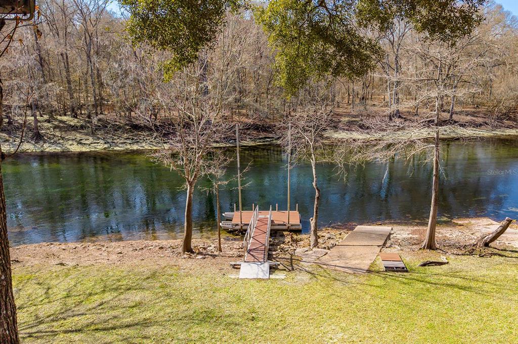 498 Southwest Manatee Terrace Fort White, FL 32038 - Photo 24 of 50 a view of a lake with a patio