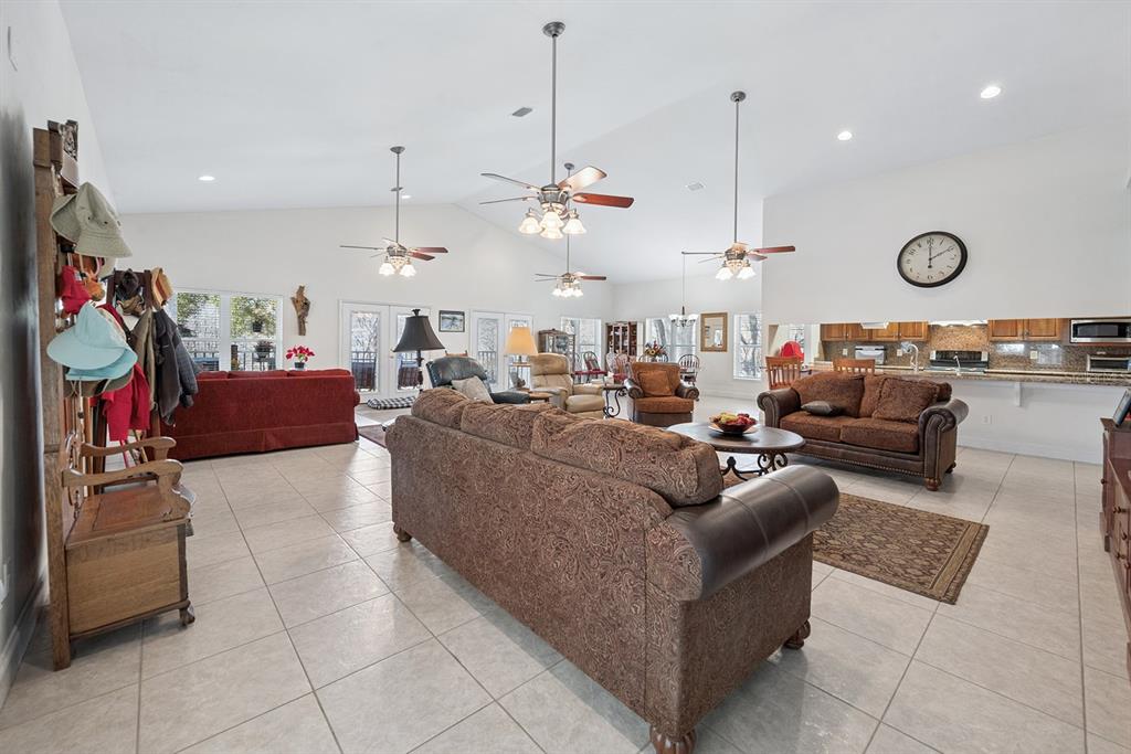 498 Southwest Manatee Terrace Fort White, FL 32038 - Photo 29 of 50 a living room with lots of furniture and kitchen view