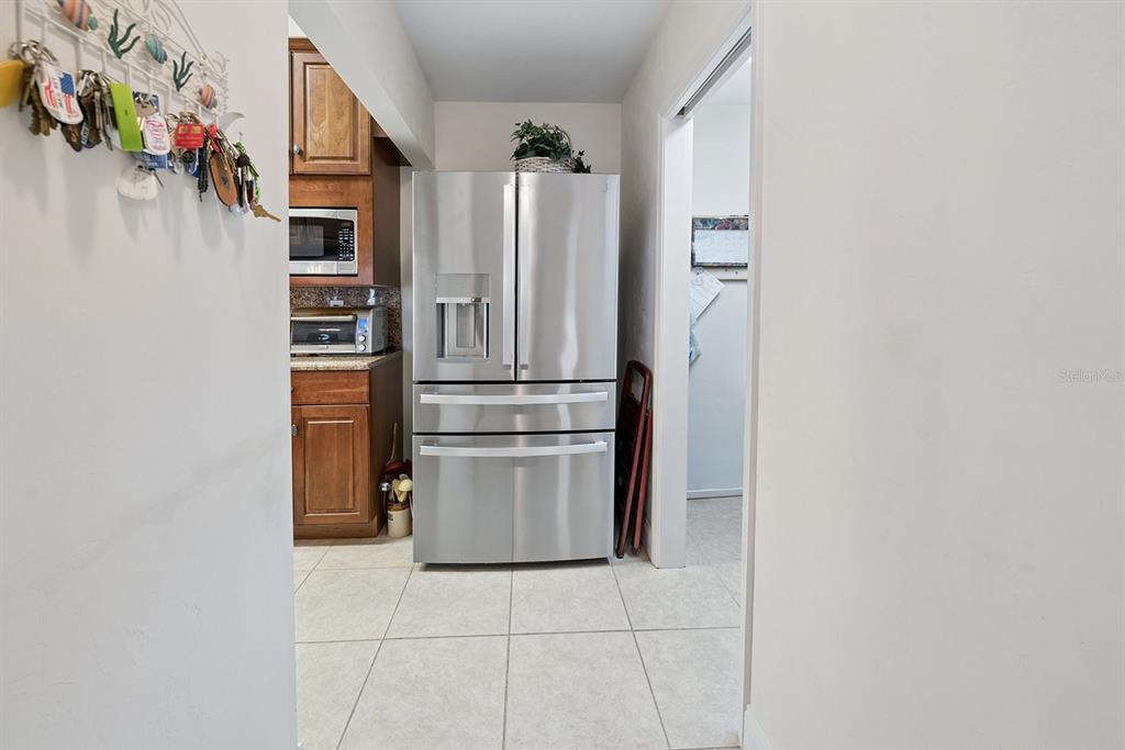 498 Southwest Manatee Terrace Fort White, FL 32038 - Photo 34 of 50 a kitchen with stainless steel appliances a refrigerator and a counter top space