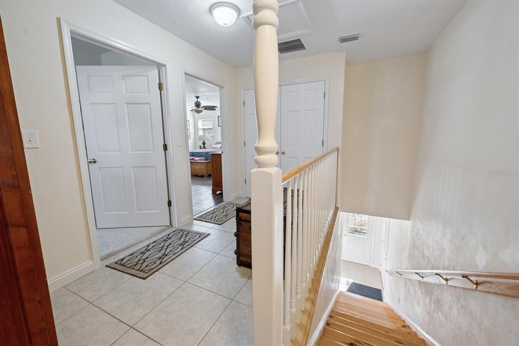 498 Southwest Manatee Terrace Fort White, FL 32038 - Photo 35 of 50 a view of a hallway view with wooden floor and staircase