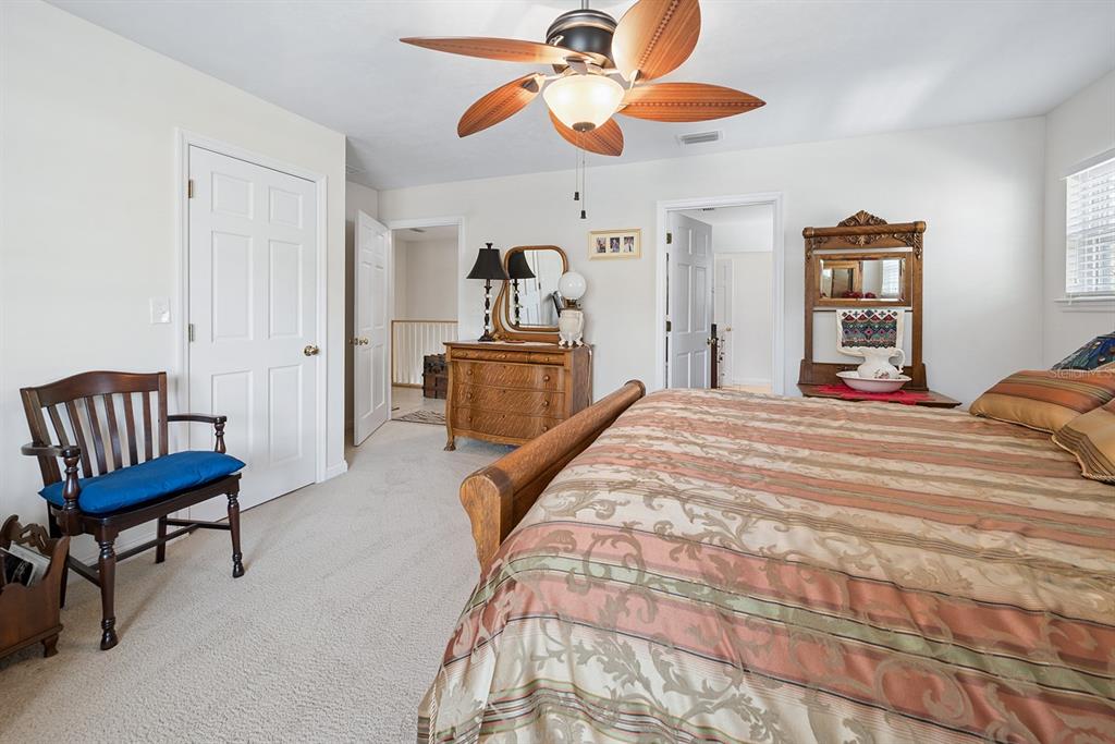 498 Southwest Manatee Terrace Fort White, FL 32038 - Photo 37 of 50 a bedroom with a bed and a chair