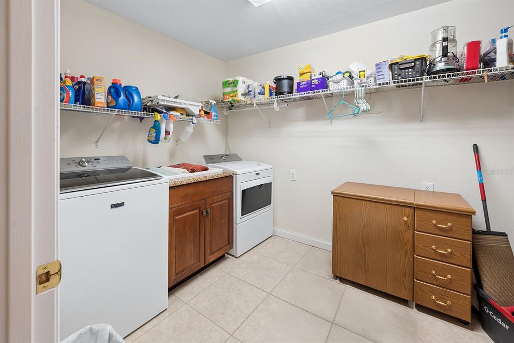 498 Southwest Manatee Terrace Fort White, FL 32038 - Photo 46 of 50 a utility room with a sink and wooden floor