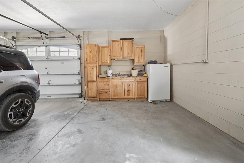 498 Southwest Manatee Terrace Fort White, FL 32038 - Photo 49 of 50 a view of a refrigerator and utility room in a kitchen