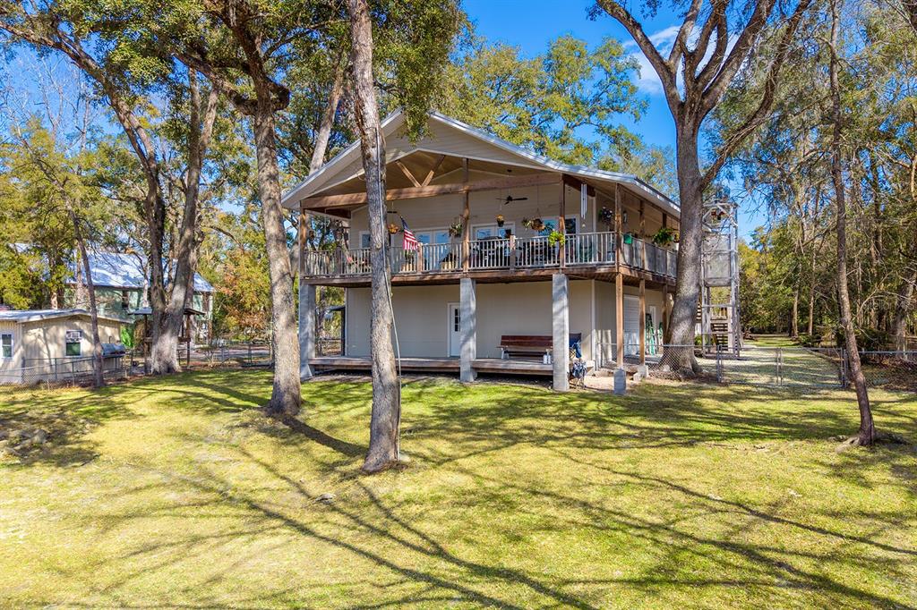 498 Southwest Manatee Terrace Fort White, FL 32038 - Photo 9 of 50 a view of a house with swimming pool and sitting area