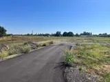 a view of a lake with houses in the back