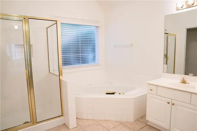 a bathroom with a bathtub and a sink