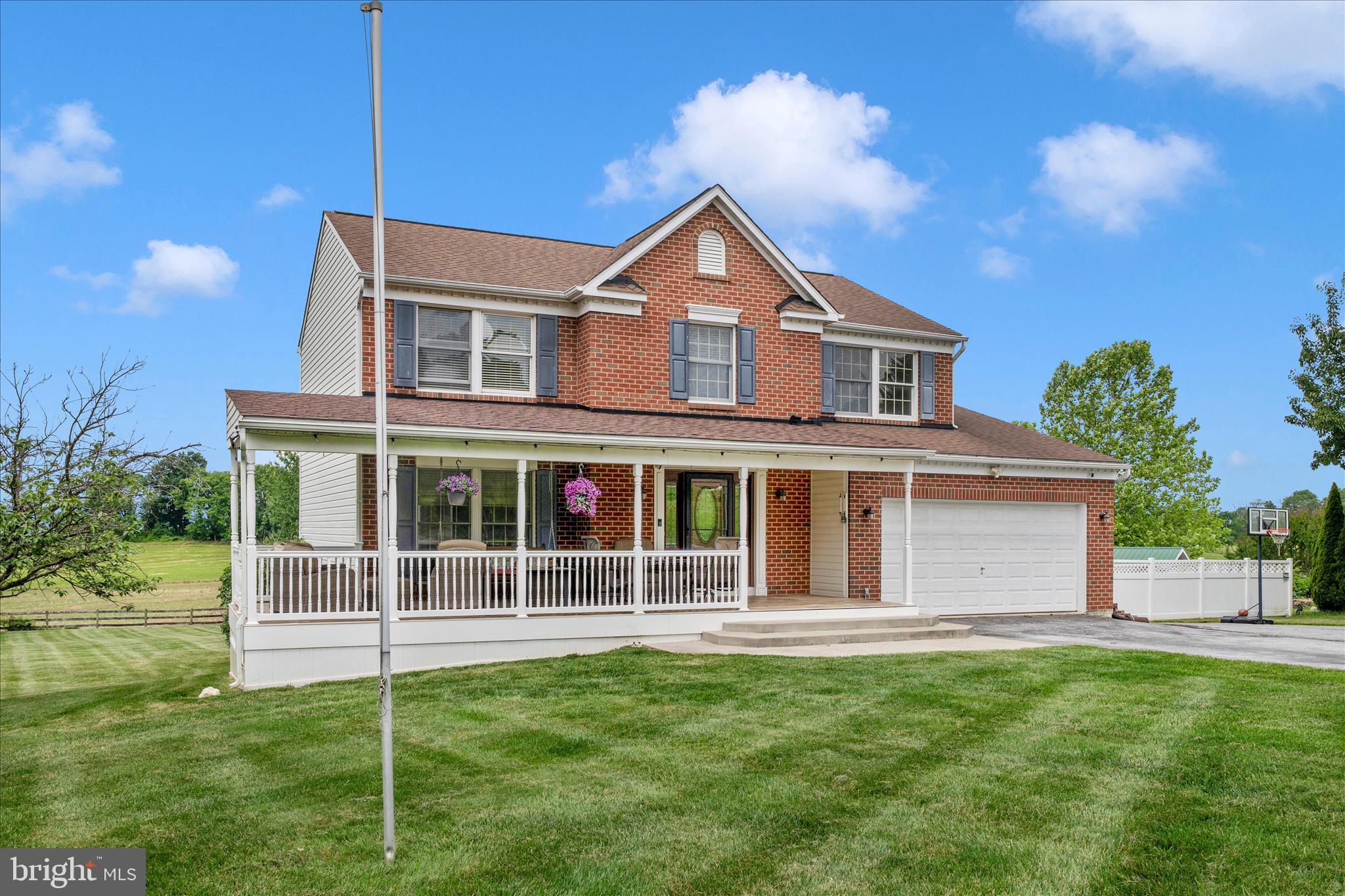 9534 Liberty Road Frederick, MD 21701 - Photo 5 of 70 a front view of a house with a garden