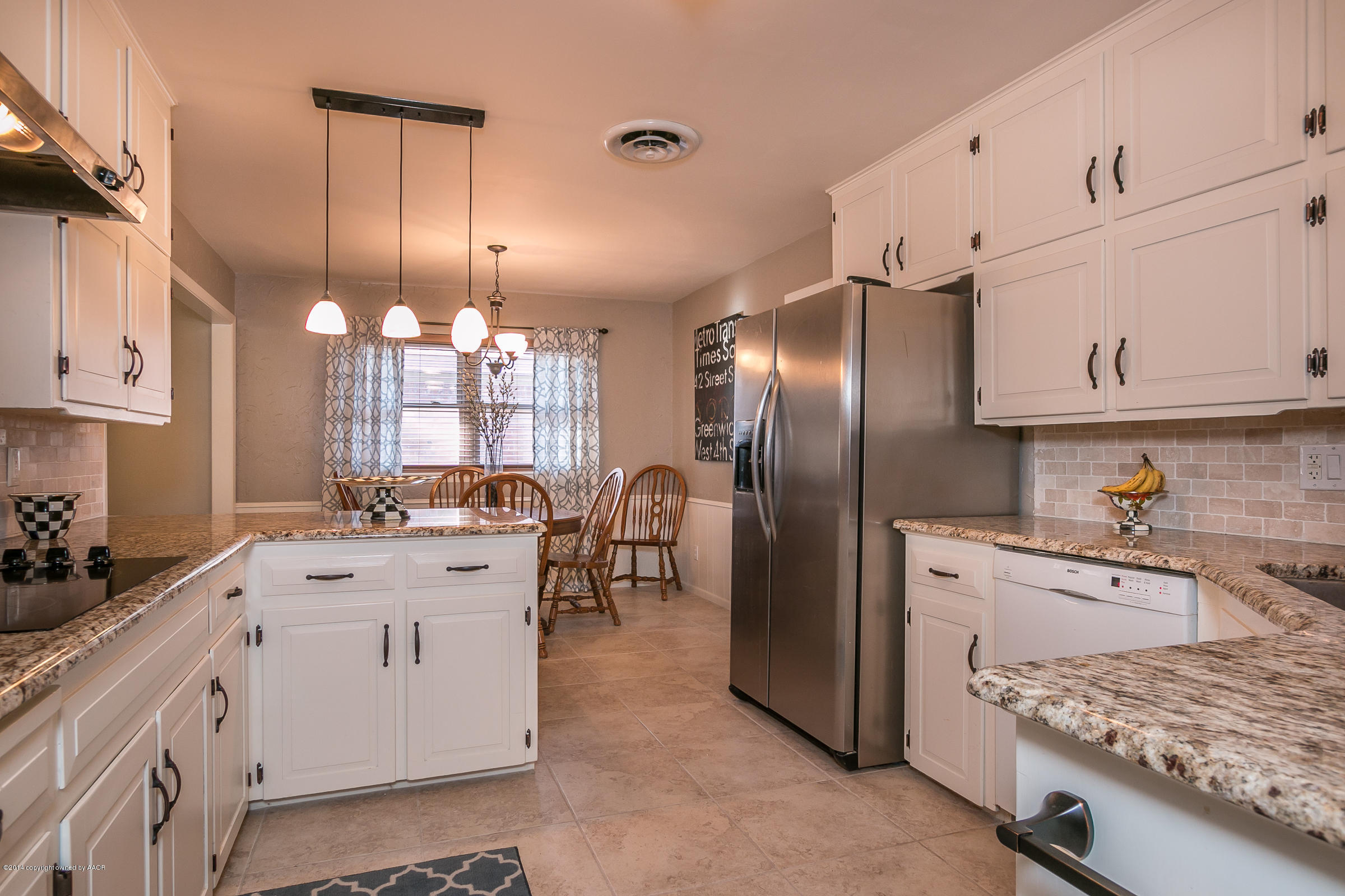 6009 Dreyfuss Road Amarillo, TX 79106 - Photo 6 of 23 a kitchen with a sink stove and refrigerator