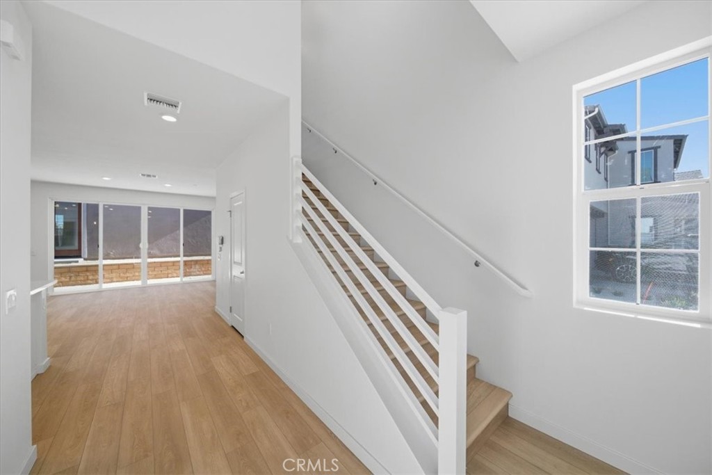 4801 Arroyo Run Moorpark, CA 93021 - Photo 13 of 27 a view of an entryway with wooden floor and stairs