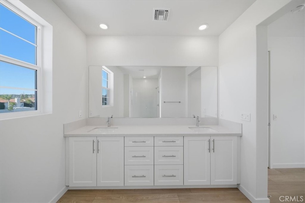 4801 Arroyo Run Moorpark, CA 93021 - Photo 18 of 27 a bathroom with a granite countertop sink and a mirror