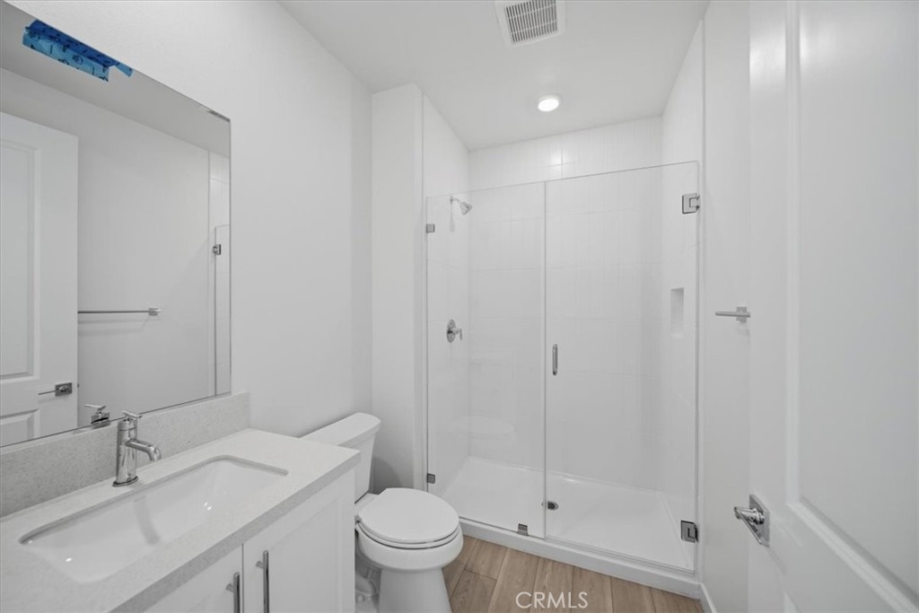 4801 Arroyo Run Moorpark, CA 93021 - Photo 25 of 27 a bathroom with a sink toilet and shower