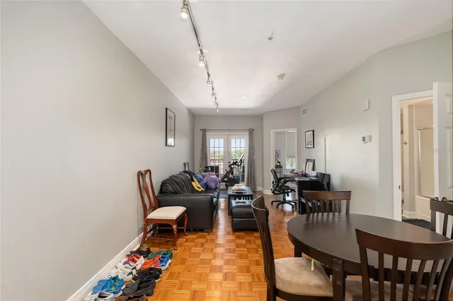 a view of a dining room with furniture and wooden floor