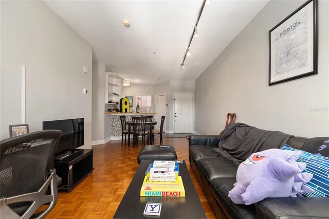 a view of a livingroom with workspace and a couch