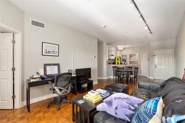 a kitchen that has a sink and a stove in it