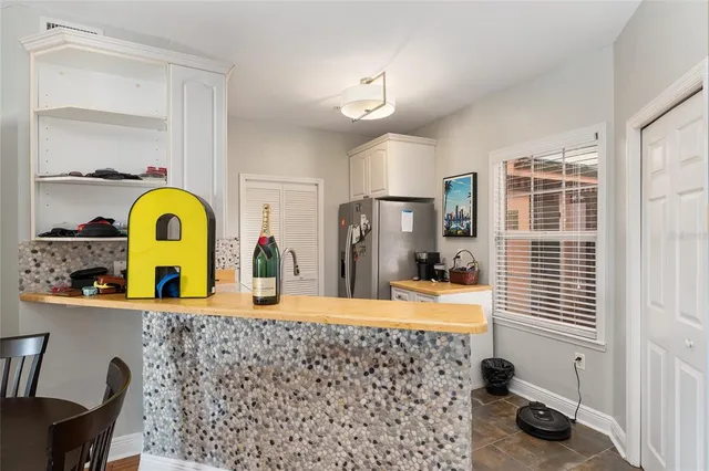 a view of a dining room with furniture and window