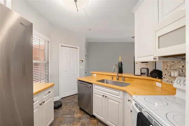 a kitchen with a sink and cabinets