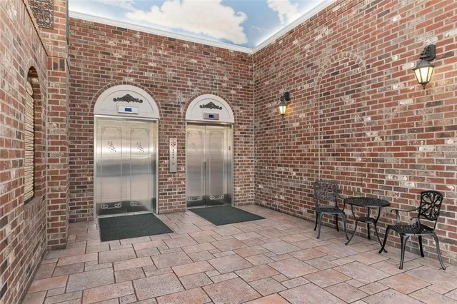 a view of a hallway with closet and entryway