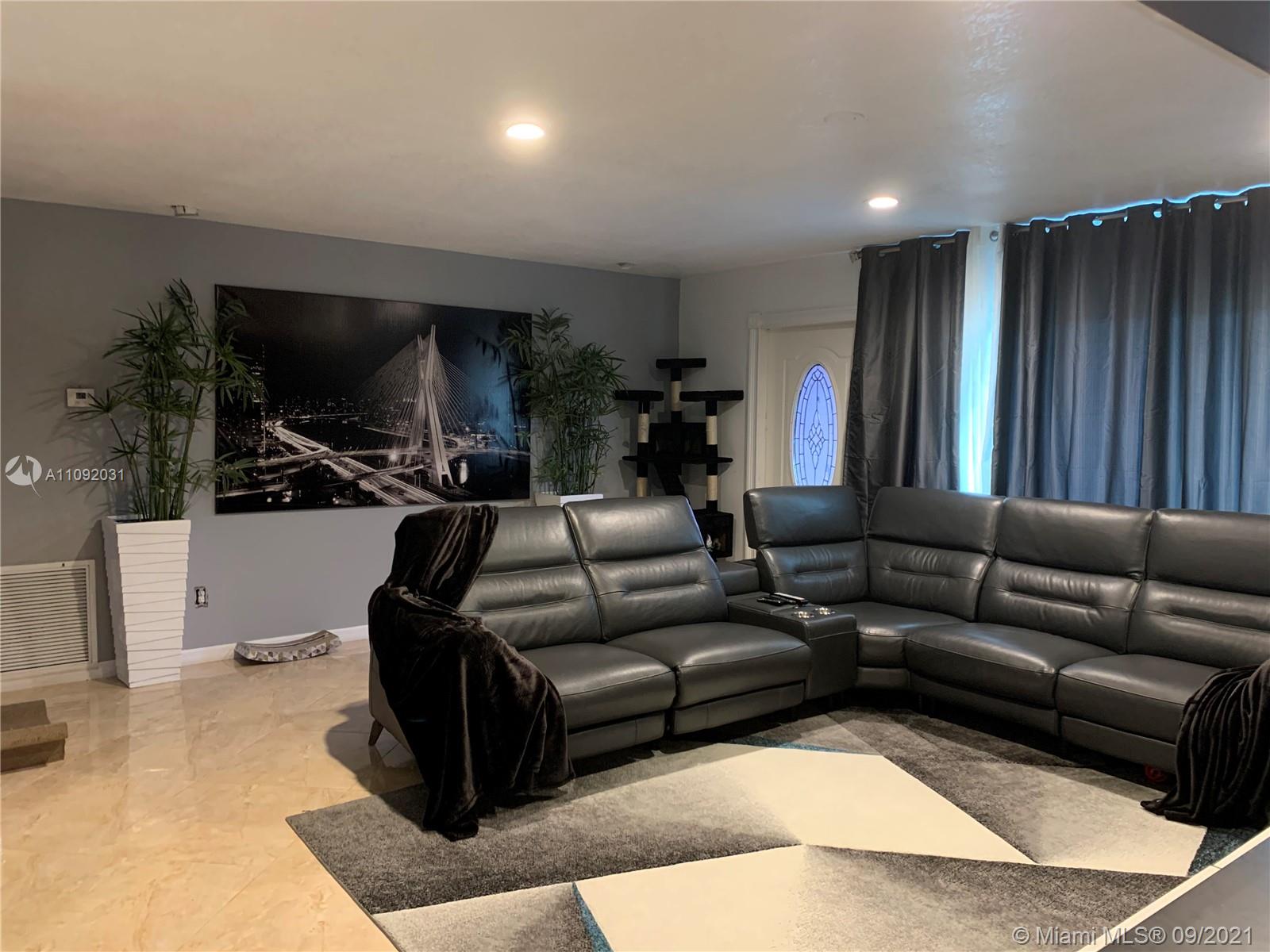 11114 Delta Circle Boca Raton, FL 33428 - Photo 11 of 15 a living room with furniture and a flat screen tv