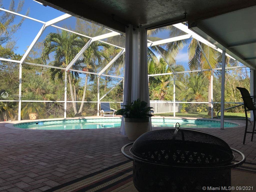 11114 Delta Circle Boca Raton, FL 33428 - Photo 15 of 15 a room with wooden floor and a large window