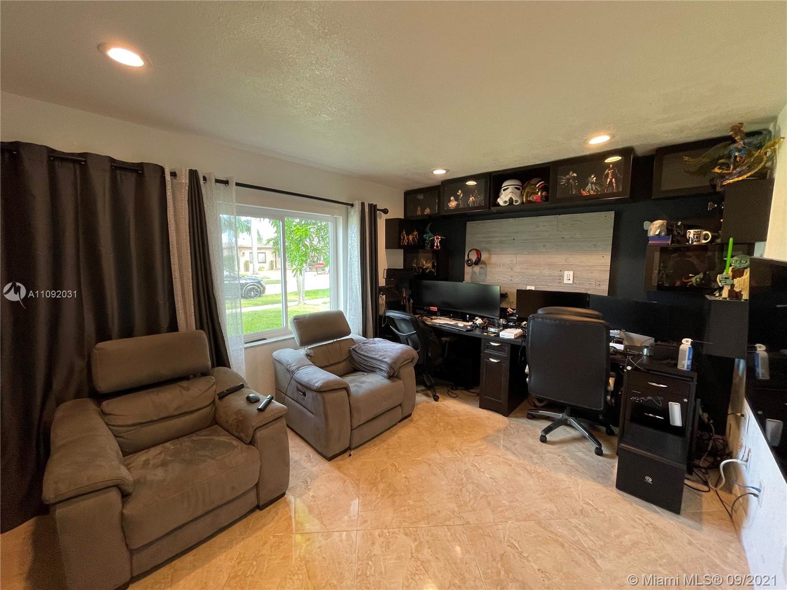 11114 Delta Circle Boca Raton, FL 33428 - Photo 7 of 15 a living room with furniture and a flat screen tv