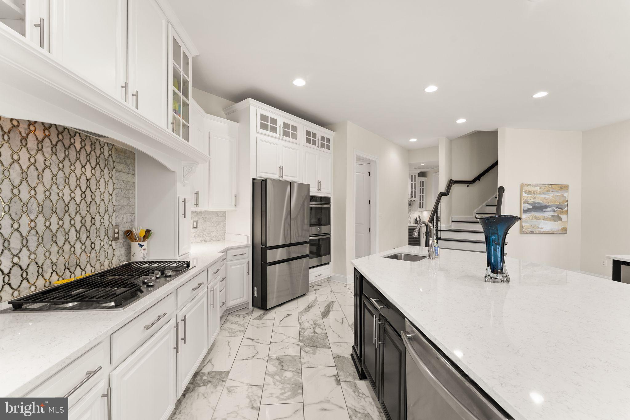 25873 Cameron Walk Place Aldie, VA 20105 - Photo 16 of 92 a kitchen with refrigerator and cabinets
