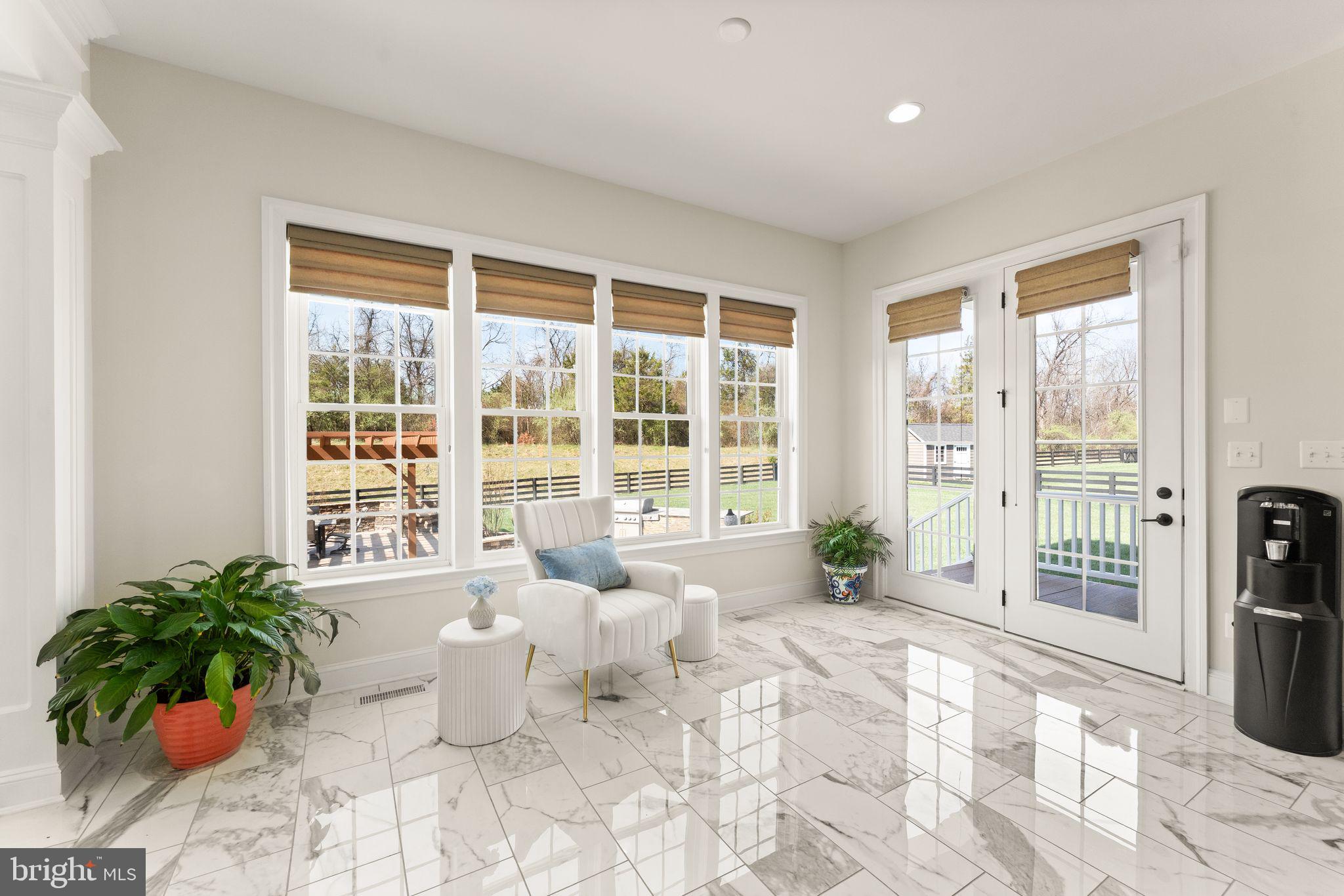 25873 Cameron Walk Place Aldie, VA 20105 - Photo 18 of 92 a living room filled with furniture and large windows