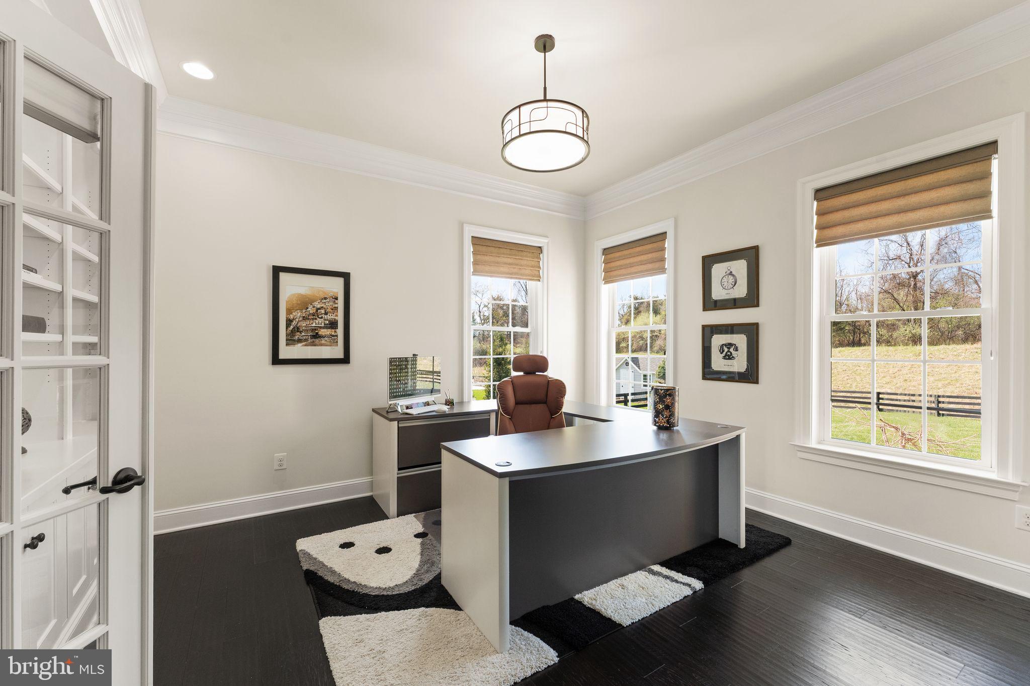 25873 Cameron Walk Place Aldie, VA 20105 - Photo 46 of 92 a room with a window wooden floor and gym equipment