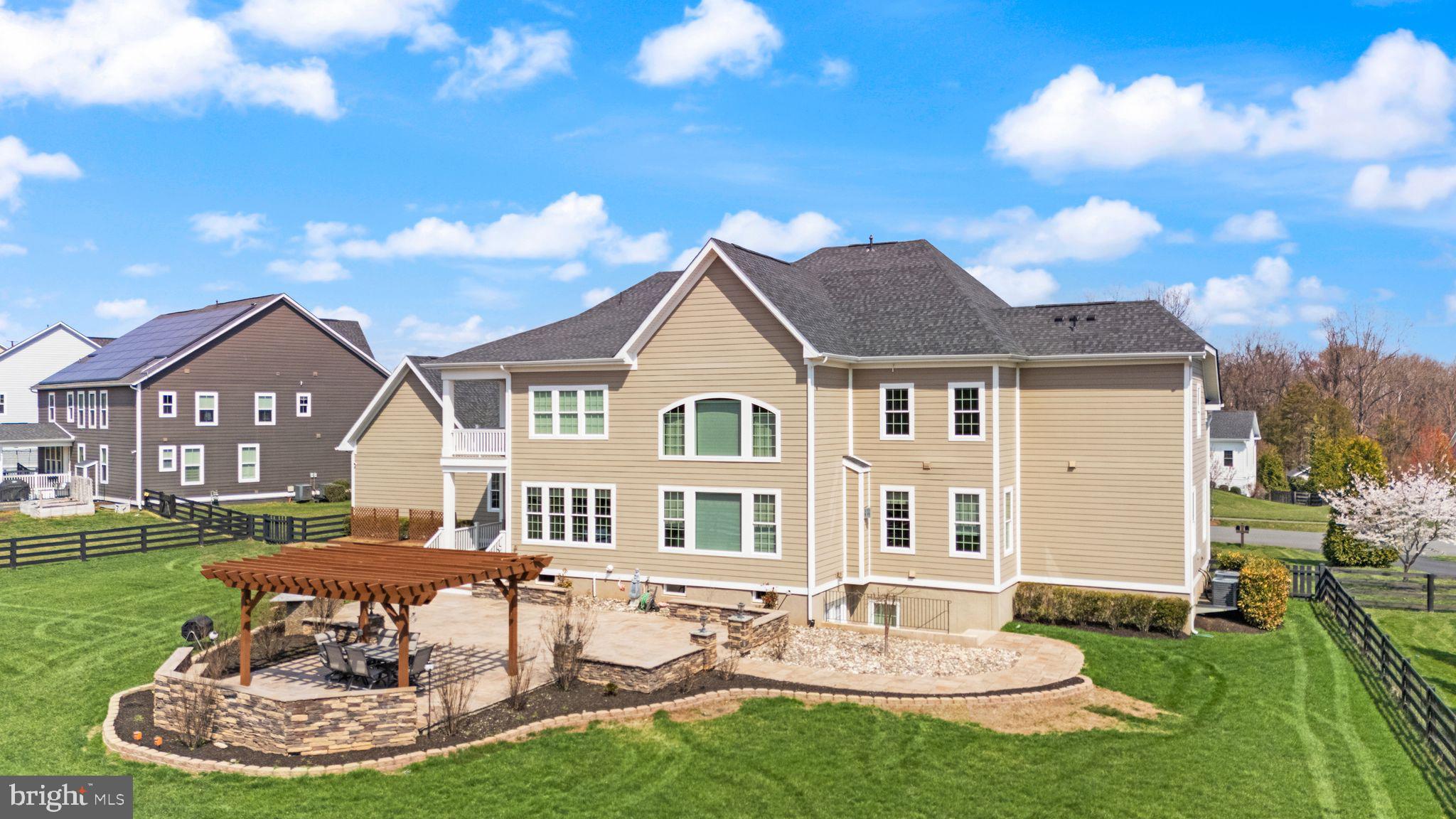 25873 Cameron Walk Place Aldie, VA 20105 - Photo 56 of 92 a front view of a house with a garden