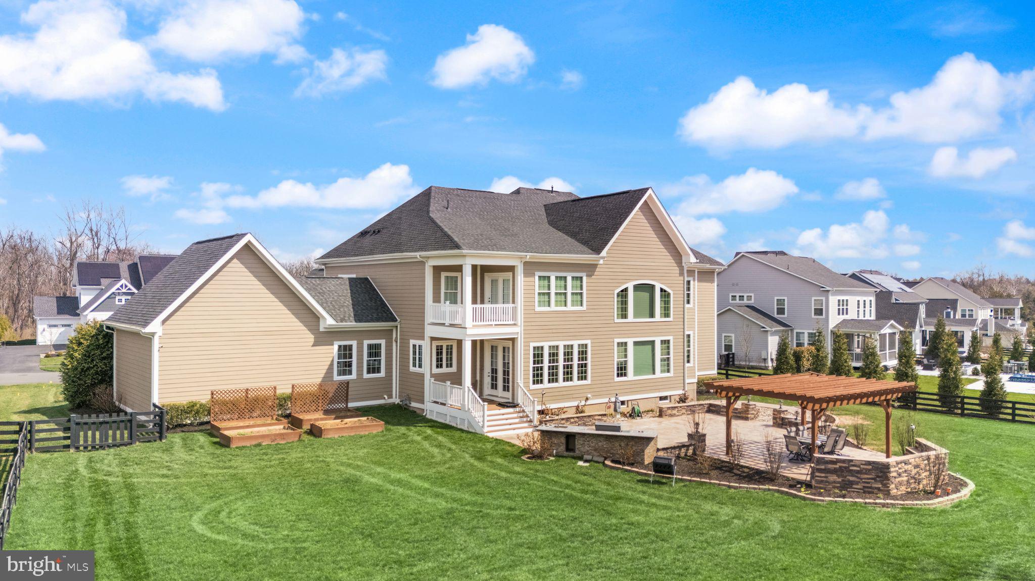25873 Cameron Walk Place Aldie, VA 20105 - Photo 59 of 92 a front view of a house with a garden and yard