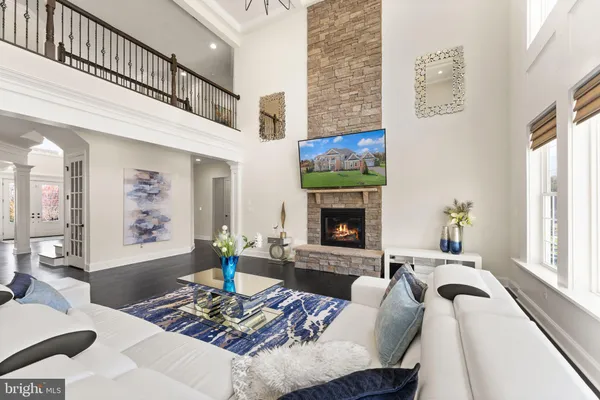 a view of a chairs and table in patio with a yard