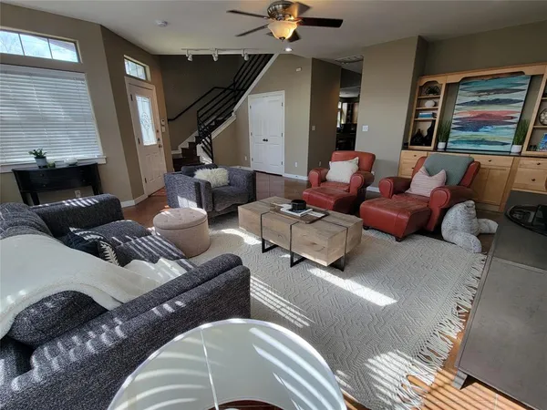 a living room with furniture and a painting