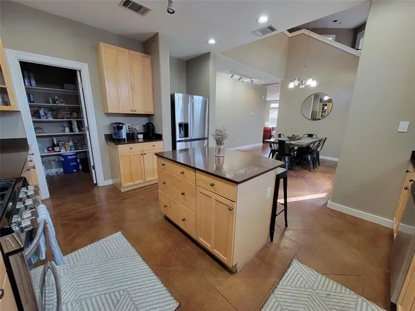 a kitchen with counter top space and stainless steel appliances