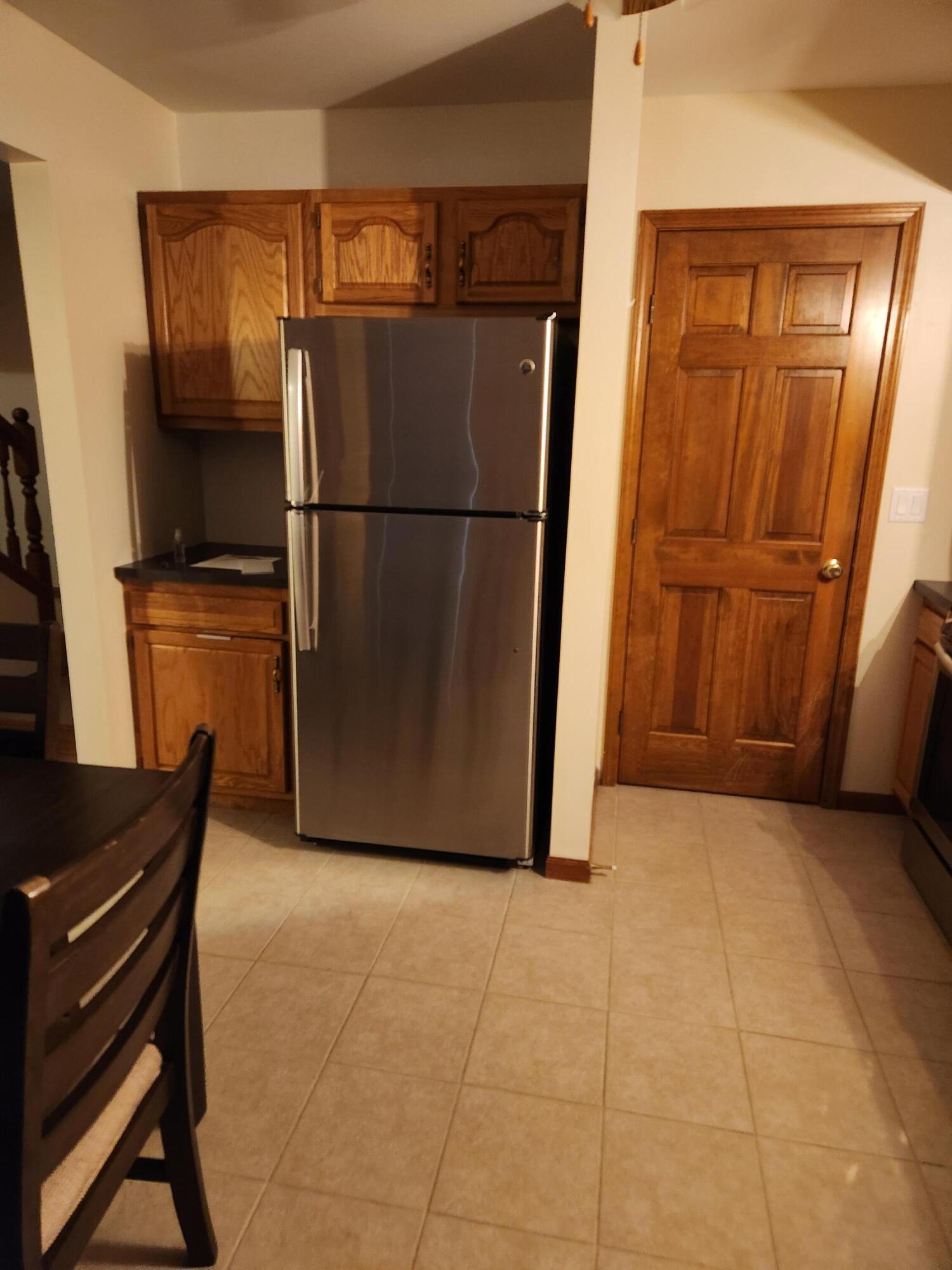 1920 David Drive Chesterton, IN 46304 - Photo 13 of 21 a view of a refrigerator in kitchen and an empty room