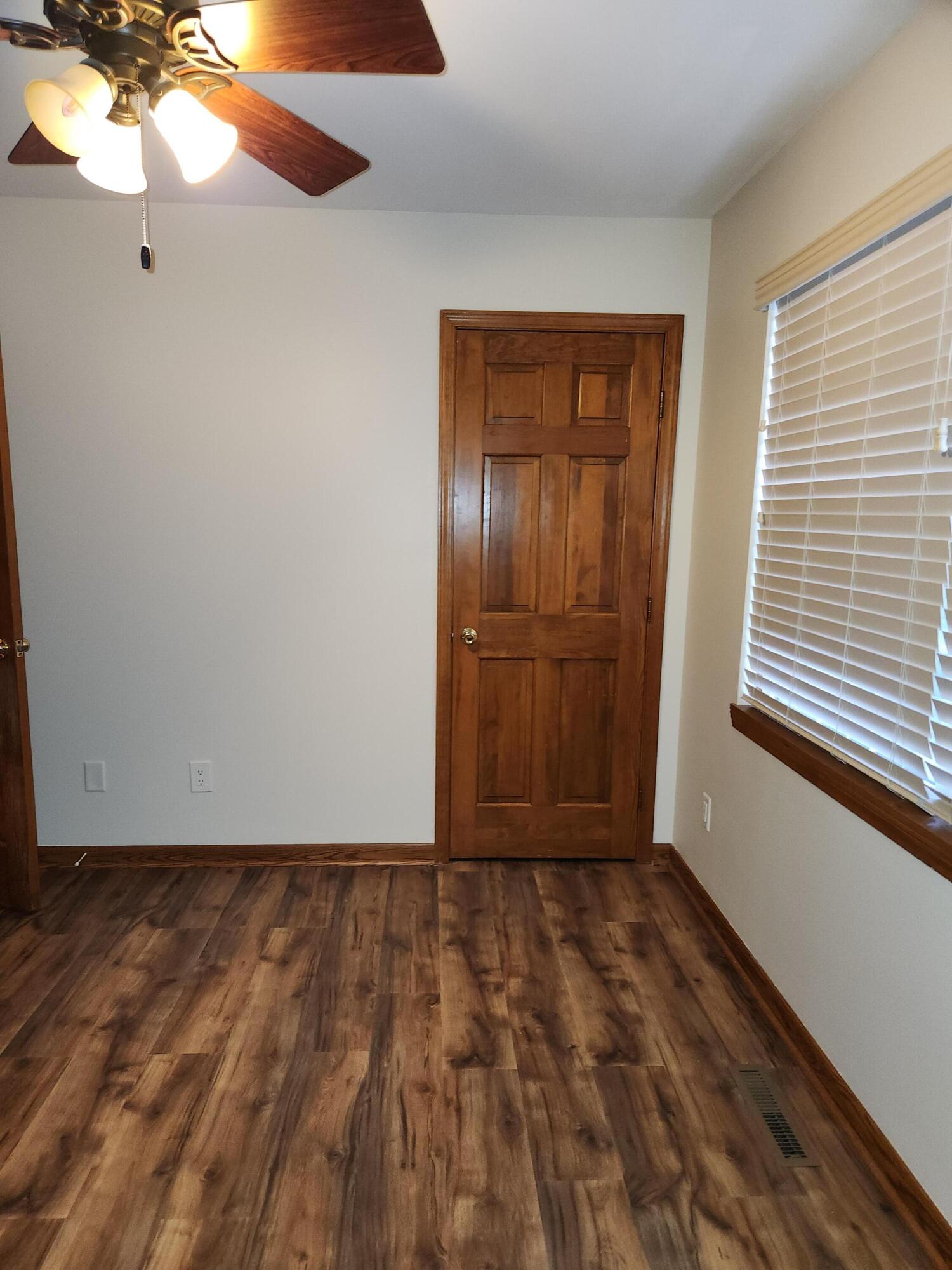 1920 David Drive Chesterton, IN 46304 - Photo 14 of 21 a view of an empty room with window and wooden floor