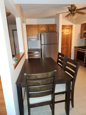 a view of kitchen with furniture and wooden floor