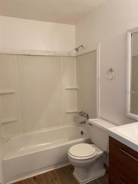 285 Wymore Road, Unit 101 Altamonte Springs, FL 32714 - Photo 5 of 9 a bathroom with a toilet a sink and bathtub