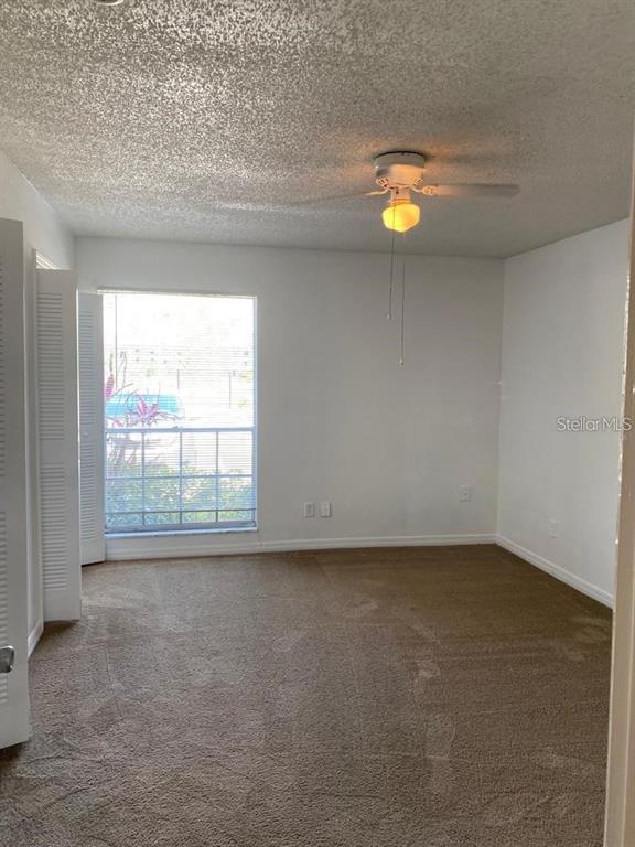 285 Wymore Road, Unit 101 Altamonte Springs, FL 32714 - Photo 7 of 9 an empty room with a window
