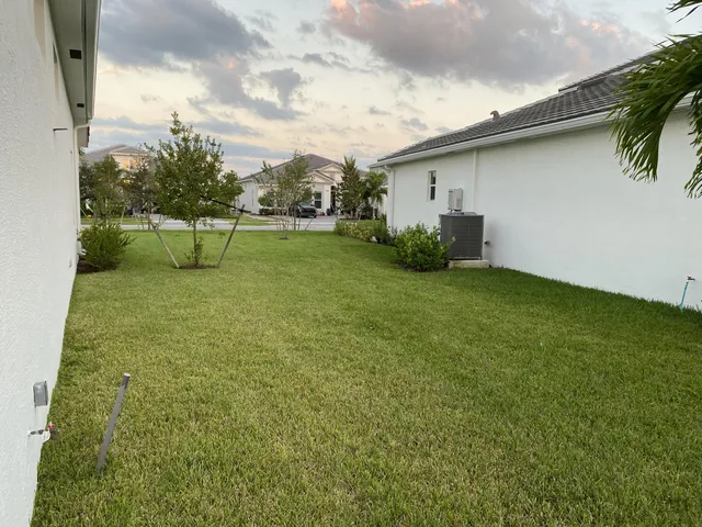 a view of yard with swimming pool and outdoor seating