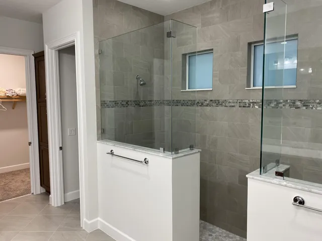 a bathroom with a double vanity sink and mirror